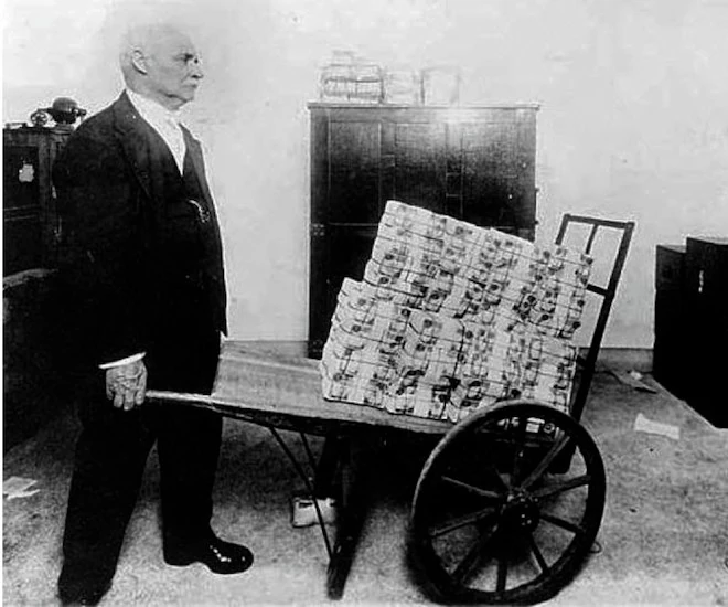 wheelbarrow of worthless paper money
